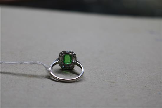 An 18ct white gold, green garnet? and diamond cluster ring, size N.